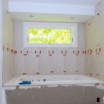 Laying tile, trowel in a preparation for laying tile.